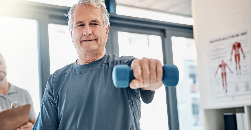 Physial therapy patient lifting weight with arm extended straight out